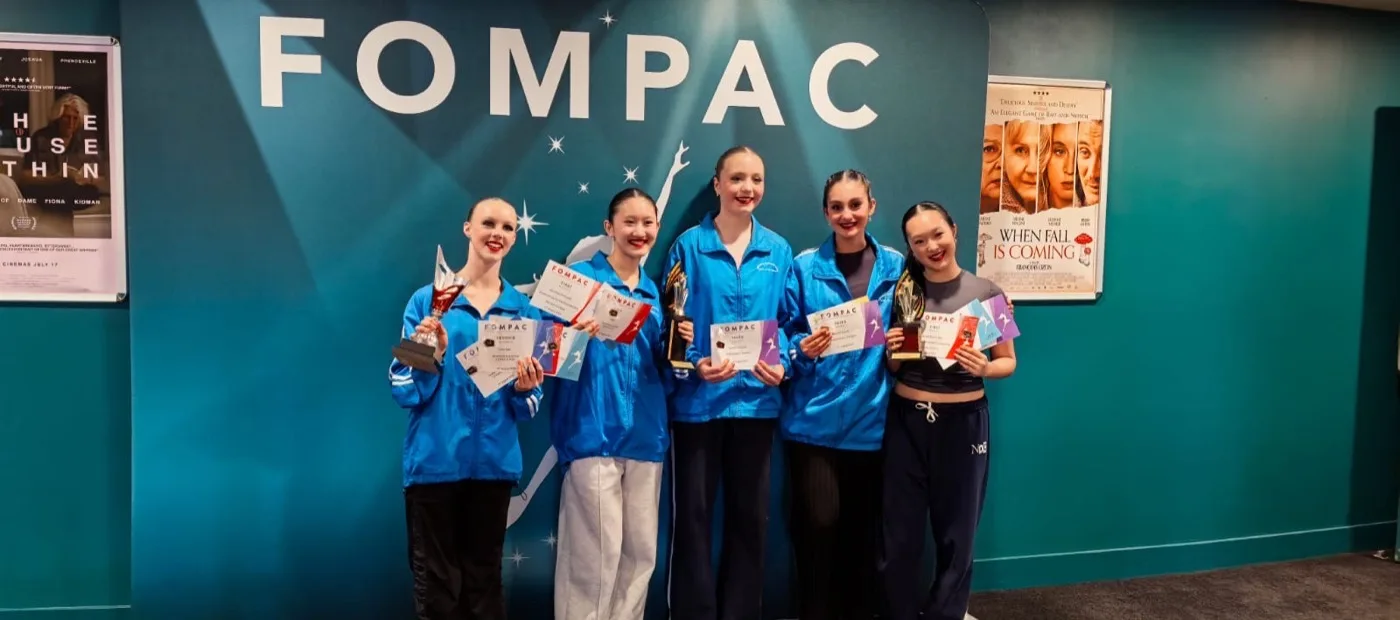 Competition dancers with their trophies at FOMPAC